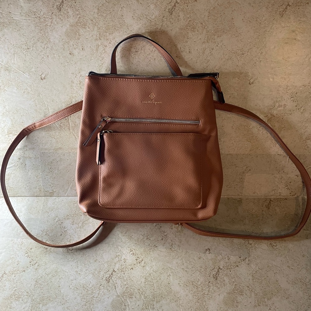 Nanette Lenora tan convertible backpack.